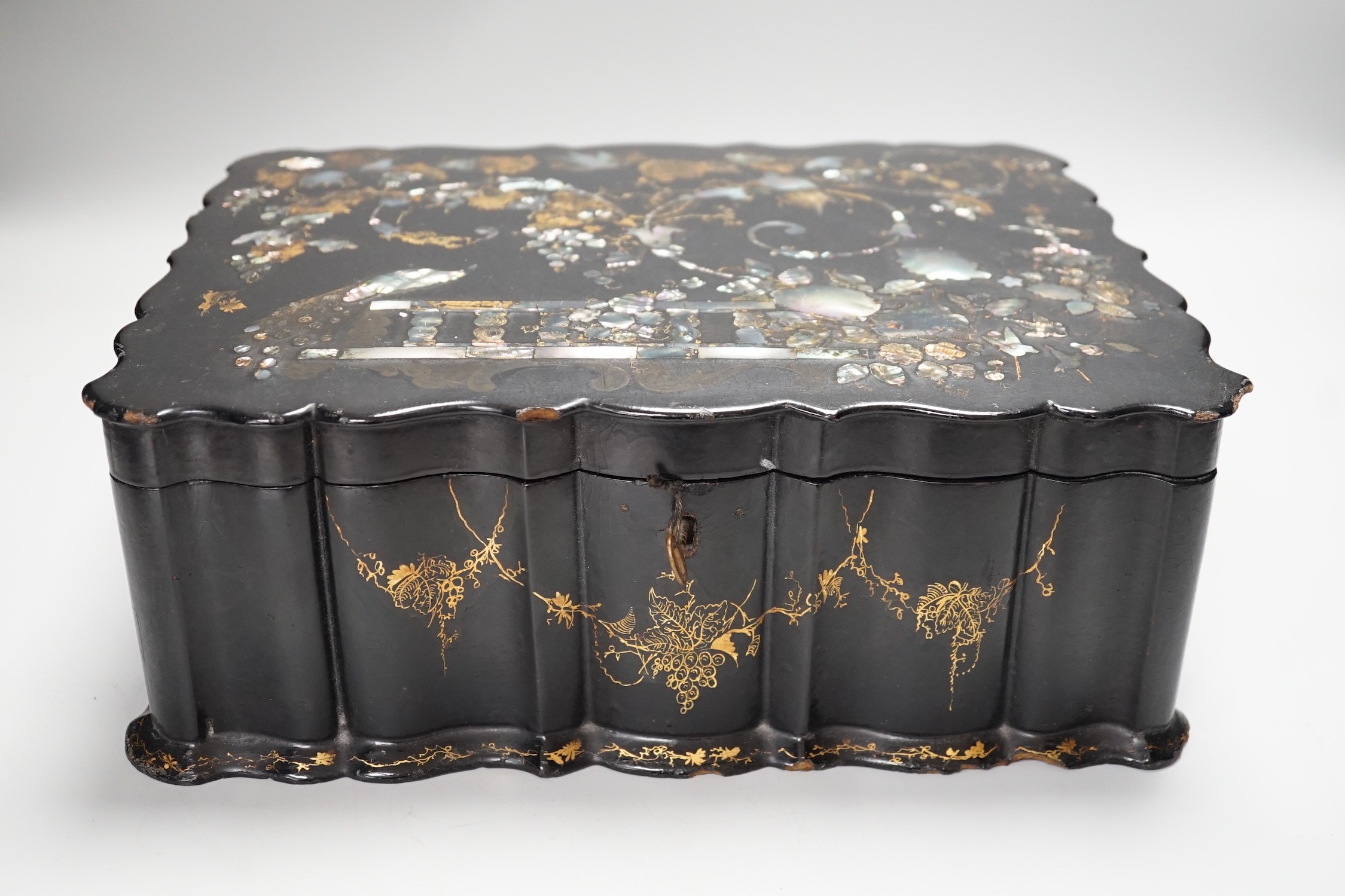 A Victorian papier mache workbox and contents, 32cm